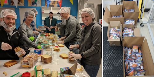 The team at FASTSIGNS of Grand Rapids works together packaging food baskets for children in need